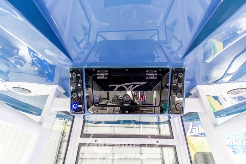 Slide: The Image of 2026 Tidewater 220 LXF boat interior with modern control panel and blue accents. - 35