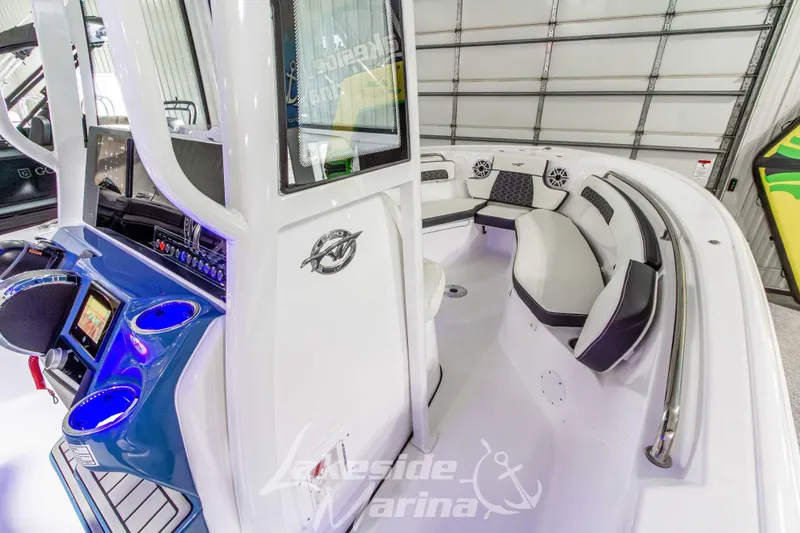 Slide: The Image of 2026 Tidewater 220 LXF boat interior with modern seating and control panel. - 36
