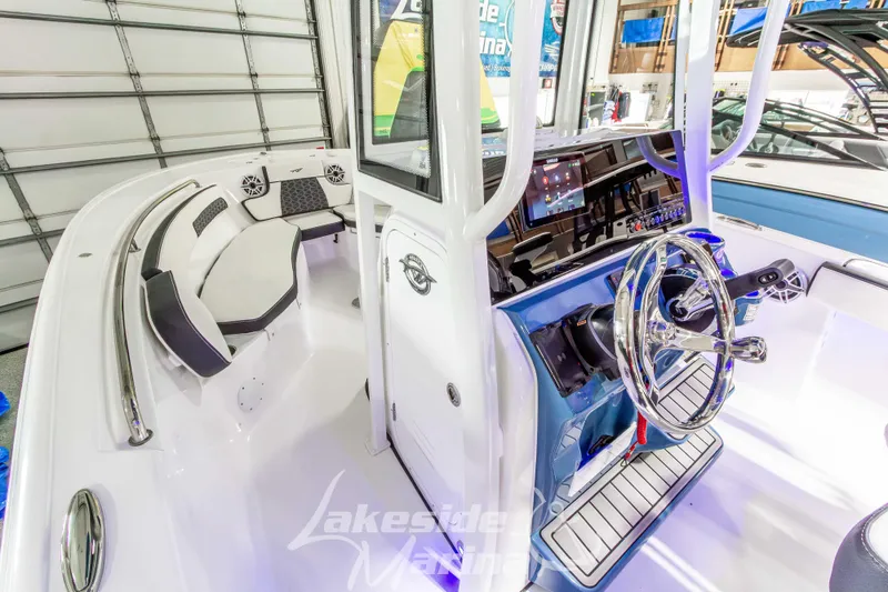 Slide: The Image of 2026 Tidewater 220 LXF boat interior with modern helm and seating. - 37
