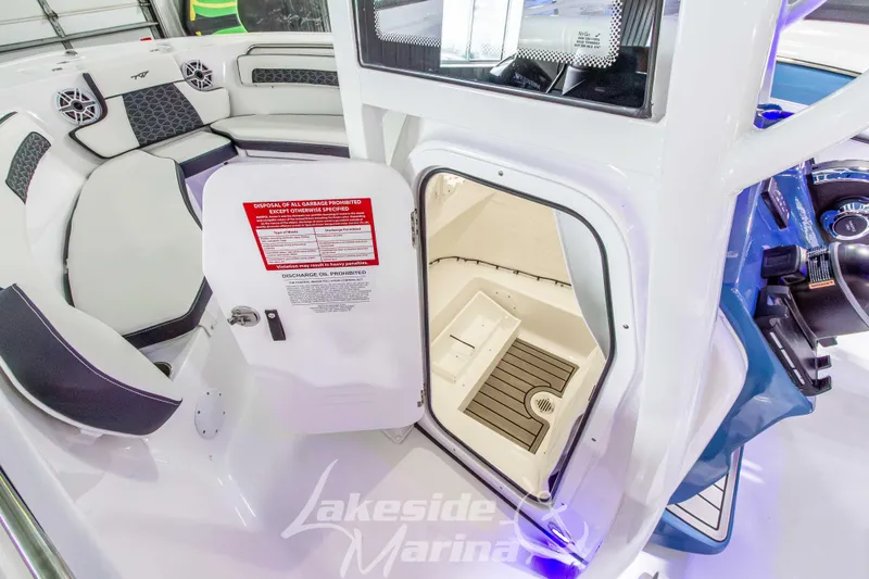 Slide: The Image of 2026 Tidewater 220 LXF boat interior with seating and storage compartment. - 38