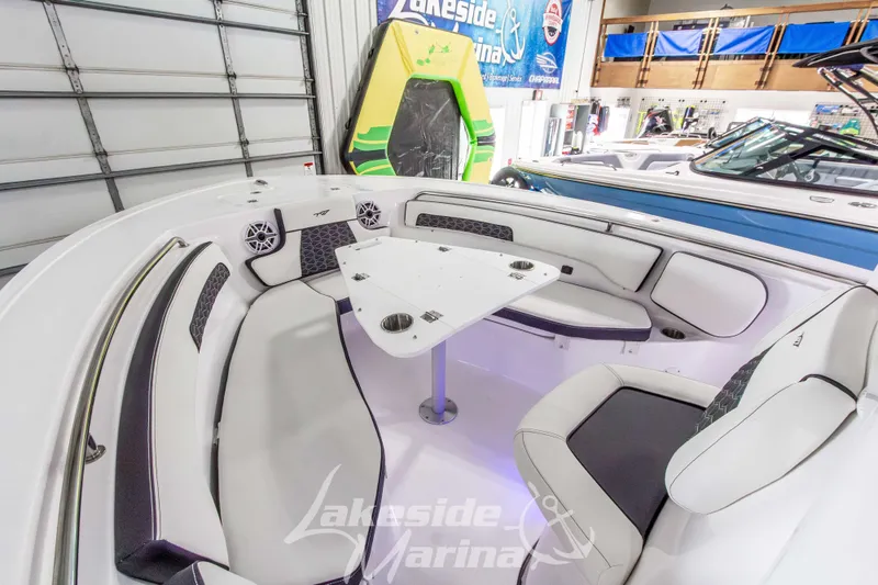 Slide: The Image of 2026 Tidewater 220 LXF boat interior with seating and table at Lakeside Marina. - 41