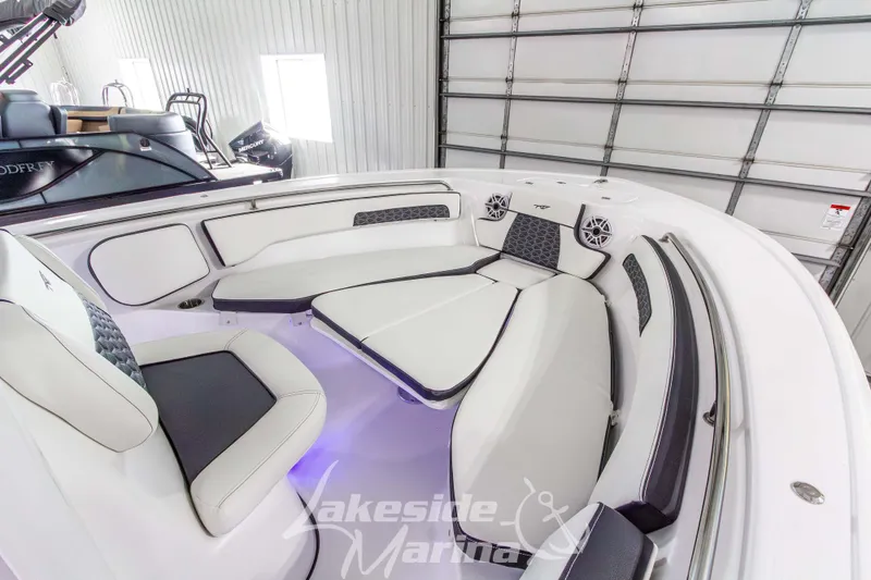 Slide: The Image of 2026 Tidewater 220 LXF boat interior with luxurious seating and modern design. - 44