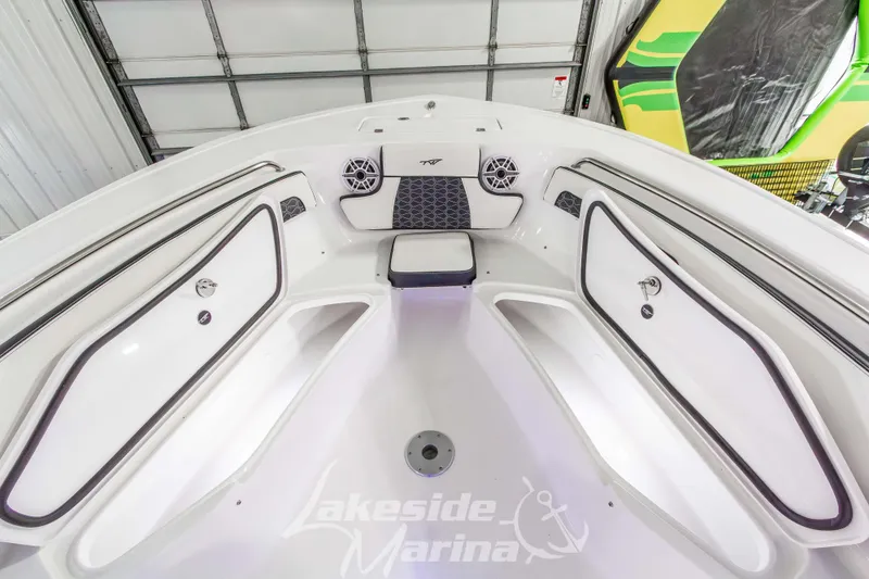 Slide: The Image of 2026 Tidewater 220 LXF boat interior with seating and storage compartments. - 49