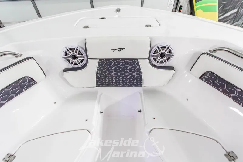 Slide: The Image of 2026 Tidewater 220 LXF boat interior with stylish seating and speakers. - 50
