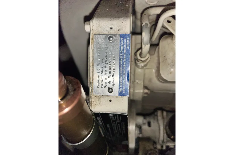 Slide: The Image of Engine label on a 1999 Nordic Tug 32, displaying technical specifications and compliance details. - 25