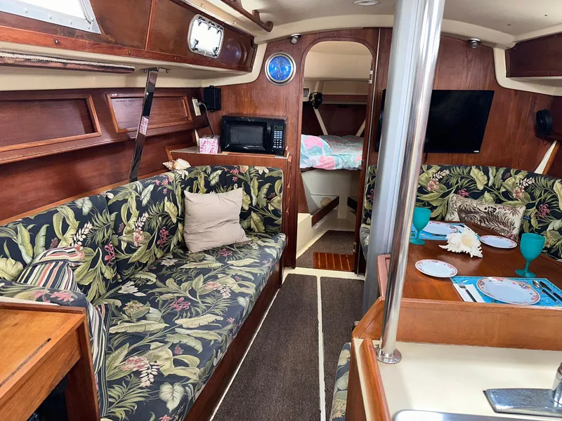 Slide: The Image of Interior of 1987 Pearson 36-2 sailboat with floral upholstery and cozy living space. - 10