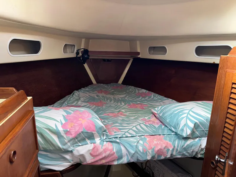Slide: The Image of Cozy cabin interior of 1987 Pearson 36-2 sailboat with floral bedding. - 15