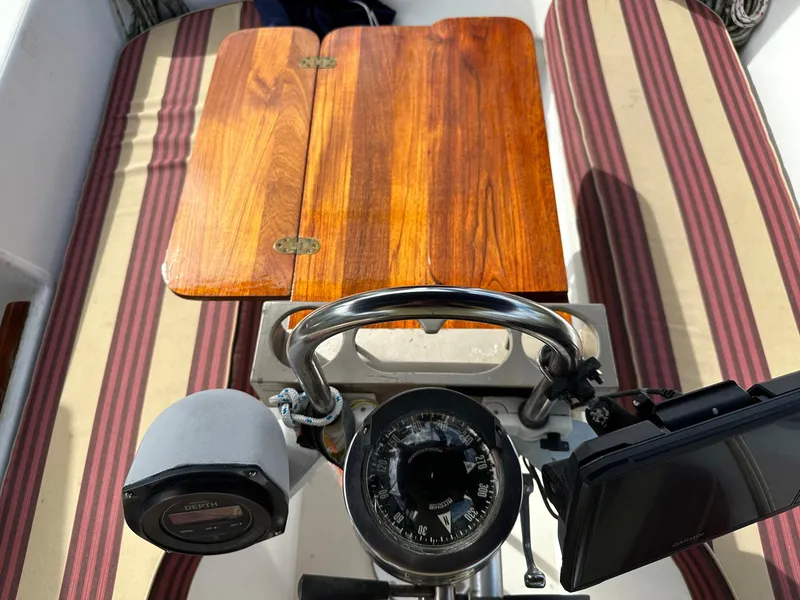 Slide: The Image of Cockpit of 1987 Pearson 36-2 sailboat with compass and wooden table. - 18