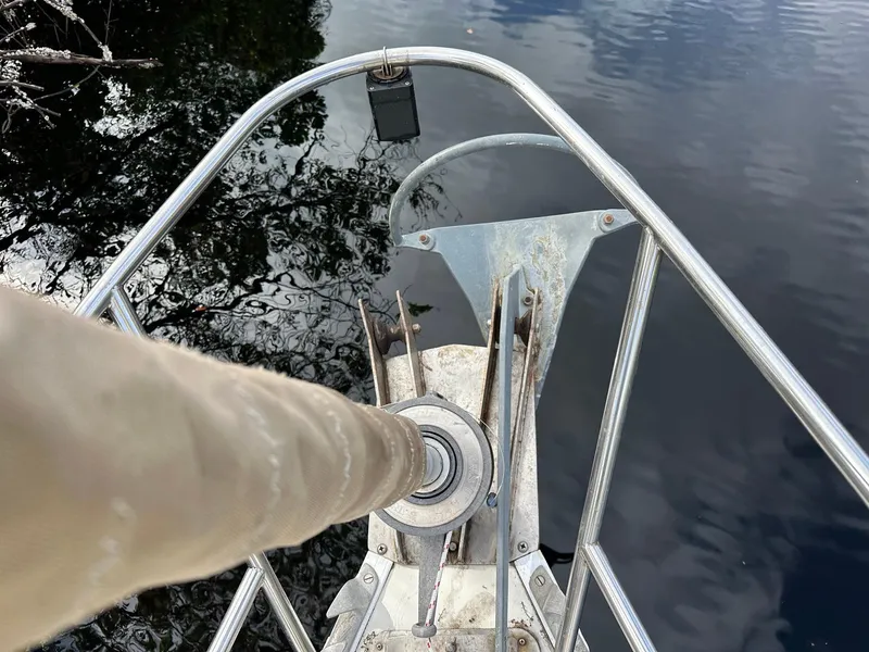 Slide: The Image of Bow of a 1987 Pearson 36-2 sailboat with anchor and calm water reflection. - 20
