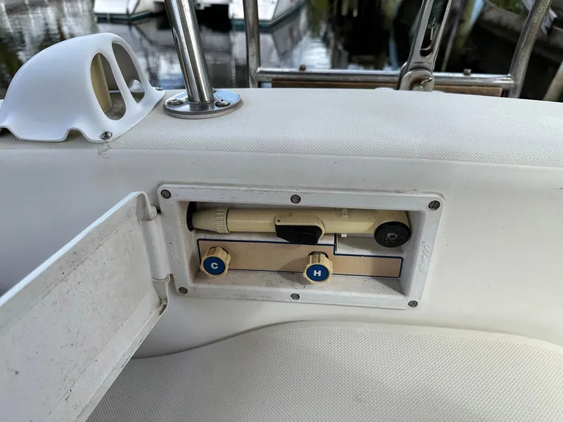Slide: The Image of Control panel on a 1987 Pearson 36-2 sailboat, featuring hot and cold water knobs. - 23