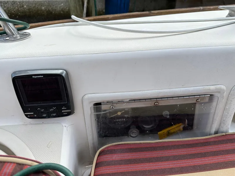Slide: The Image of Control panel on a 1987 Pearson 36-2 sailboat cockpit with navigation equipment. - 24