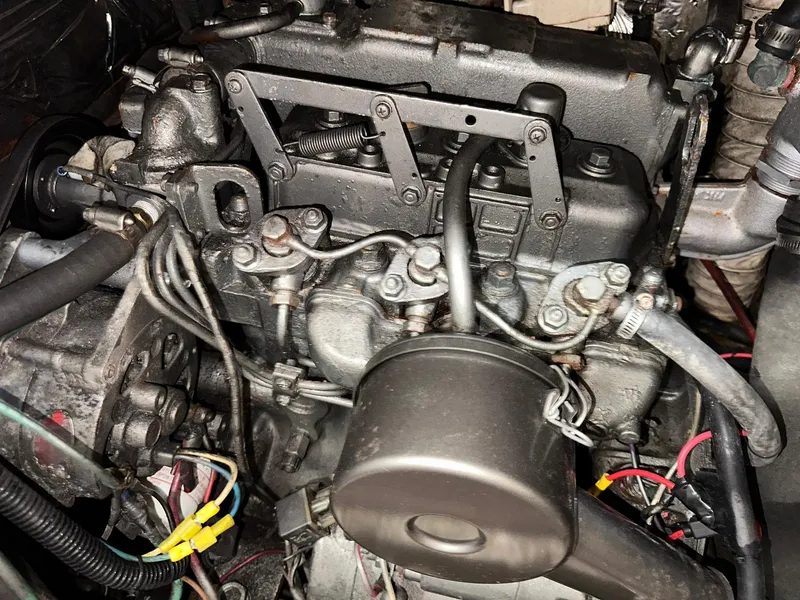 Slide: The Image of Engine of a 1987 Pearson 36-2 sailboat, showcasing mechanical components and wiring. - 26