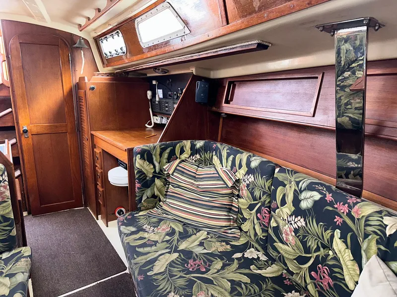Slide: The Image of Interior of 1987 Pearson 36-2 sailboat with floral upholstery and wooden cabinetry. - 3