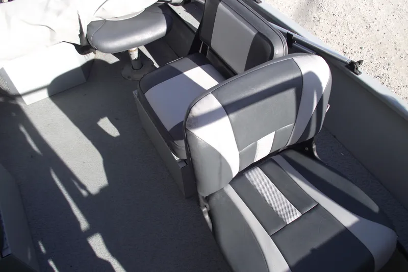 Slide: The Image of 2012 Smoker Craft Pro Angler XL 162 boat interior with gray and black seating. - 14