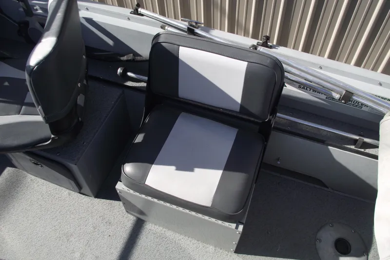 Slide: The Image of 2012 Smoker Craft Pro Angler XL 162 boat interior with gray and black seating. - 15