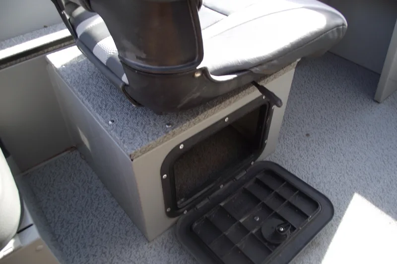 Slide: The Image of 2012 Smoker Craft Pro Angler XL 162 boat seat with open storage compartment. - 18