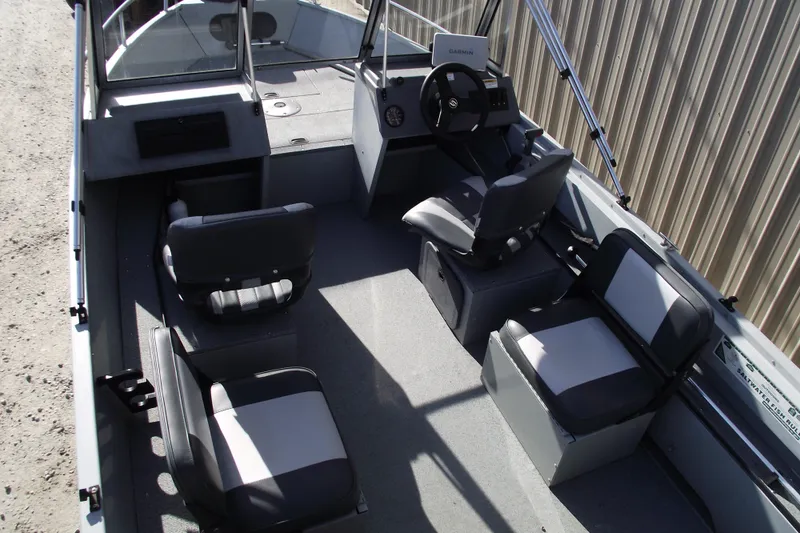 Slide: The Image of 2012 Smoker Craft Pro Angler XL 162 boat interior with seating and steering console. - 20