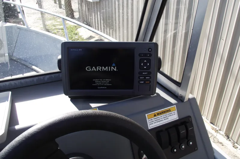 Slide: The Image of Garmin GPS on 2012 Smoker Craft Pro Angler XL 162 boat dashboard. - 9