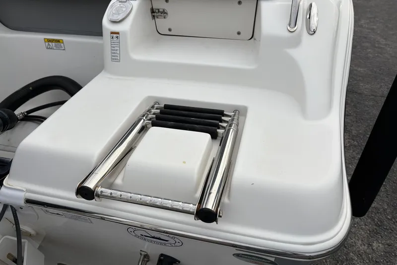 Slide: The Image of 2022 NauticStar 2302 Legacy boat ladder and deck detail. - 10