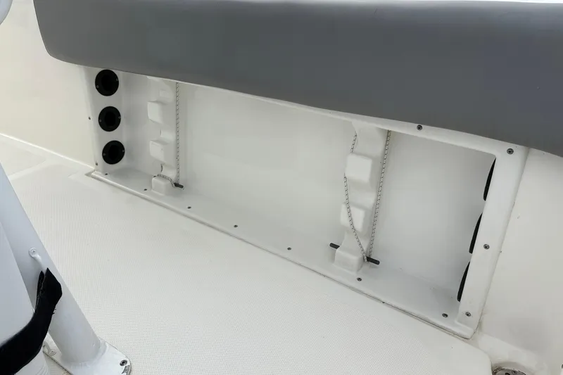 Slide: The Image of 2022 NauticStar 2302 Legacy boat interior detail with storage compartment. - 15