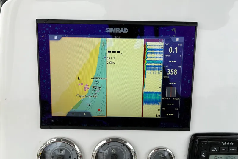 Slide: The Image of Simrad navigation display on 2022 NauticStar 2302 Legacy boat dashboard. - 23