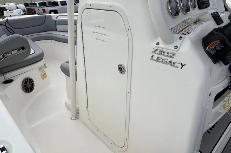 Slide: The Image of 2022 NauticStar 2302 Legacy boat interior with seating and control panel. - 26