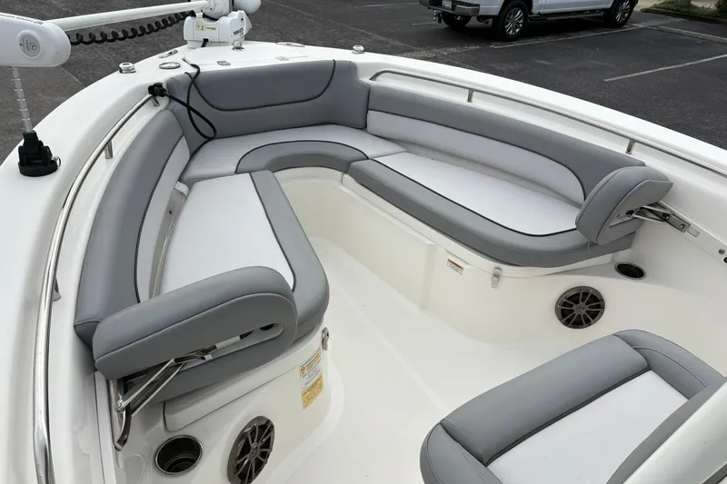 Slide: The Image of 2022 NauticStar 2302 Legacy boat with spacious gray seating and modern design. - 28