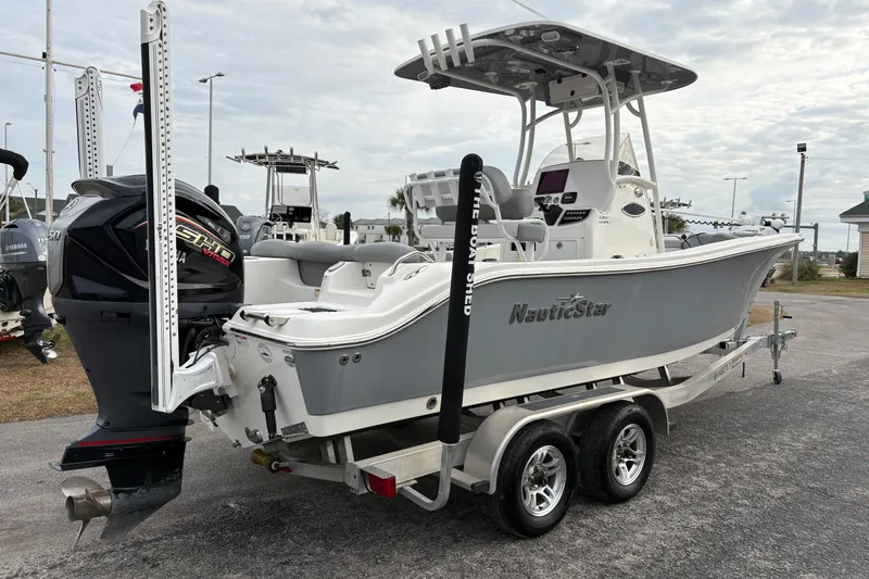 Slide: The Image of 2022 NauticStar 2302 Legacy boat on trailer with Yamaha outboard motor. - 4