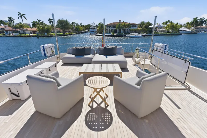 Slide: The Image of Luxurious 2018 Ferretti Yachts 920 interior with elegant seating and scenic water views. - 12