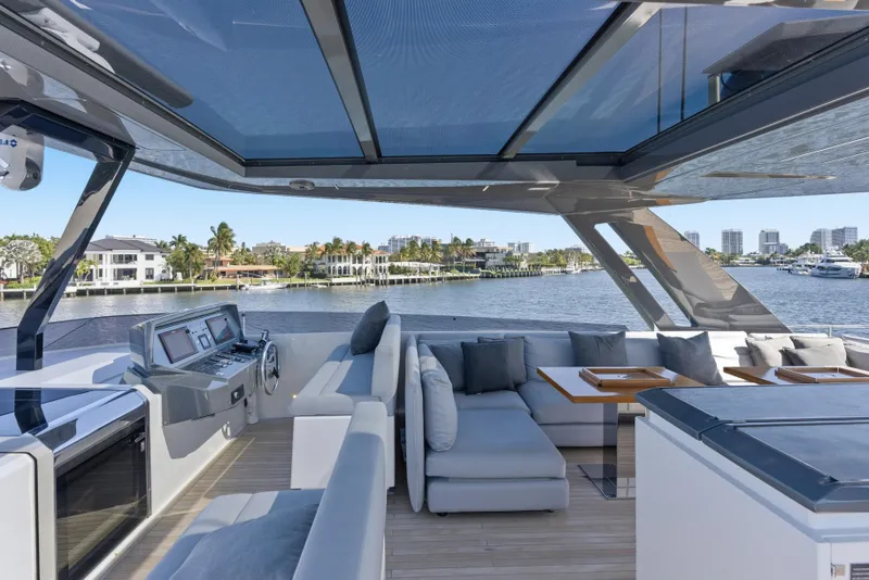 Slide: The Image of Luxurious 2018 Ferretti Yachts 920 deck with elegant seating and scenic marina view. - 14