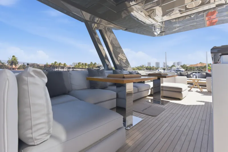 Slide: The Image of 2018 Ferretti Yachts 920 helm with panoramic water view, modern controls, and luxurious seating. - 15