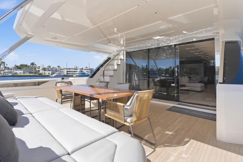 Slide: The Image of Luxurious 2018 Ferretti Yachts 920 deck with elegant seating and waterfront view. - 20
