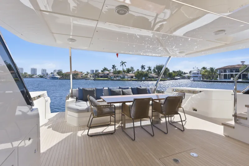Slide: The Image of Luxurious 2018 Ferretti Yachts 920 deck with elegant seating and waterfront view. - 21