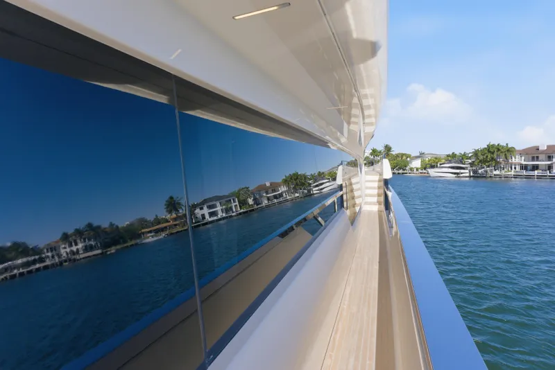 Slide: The Image of 2018 Ferretti Yachts 920 on serene water, showcasing sleek design and luxury features. - 24