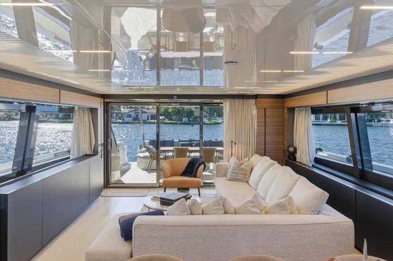 Slide: The Image of Luxurious interior of 2018 Ferretti Yachts 920 with elegant dining area and scenic window view. - 33