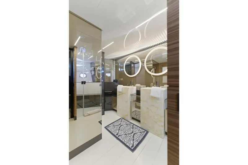 Slide: The Image of Luxurious bathroom on 2018 Ferretti Yachts 920 with dual sinks and illuminated mirrors. - 49