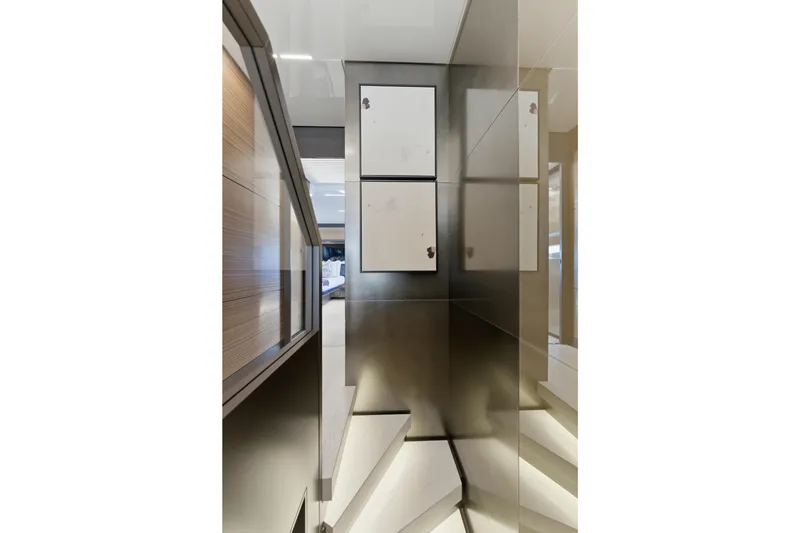 Slide: The Image of Luxurious interior of 2018 Ferretti Yachts 920 with modern staircase and elegant decor. - 57