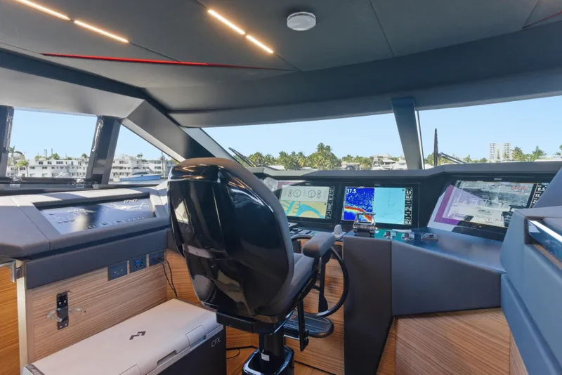 Slide: The Image of Cockpit of 2018 Ferretti Yachts 920 with advanced navigation displays and controls. - 75