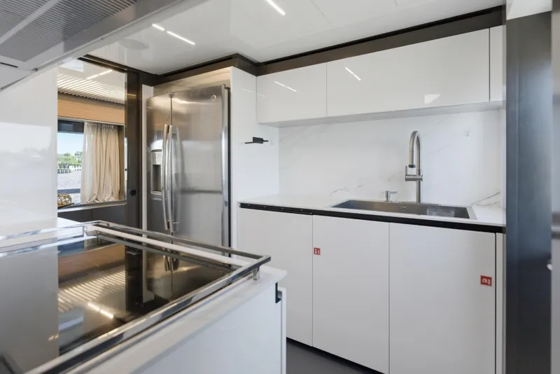 Slide: The Image of Modern kitchen interior on 2018 Ferretti Yachts 920, featuring sleek stainless steel appliances. - 79