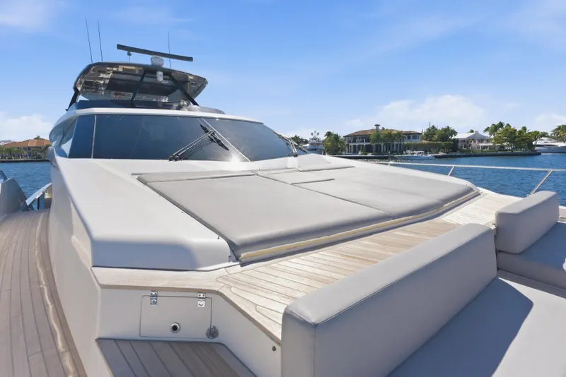 Slide: The Image of Luxurious 2018 Ferretti Yachts 920 on serene waterway, featuring spacious deck seating. - 8
