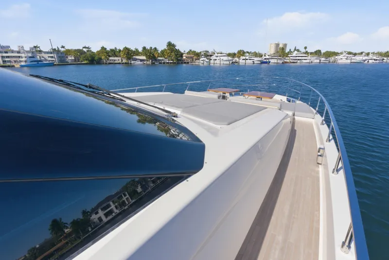 Slide: The Image of Luxurious 2018 Ferretti Yachts 920 deck with wooden tables and ocean view. - 25