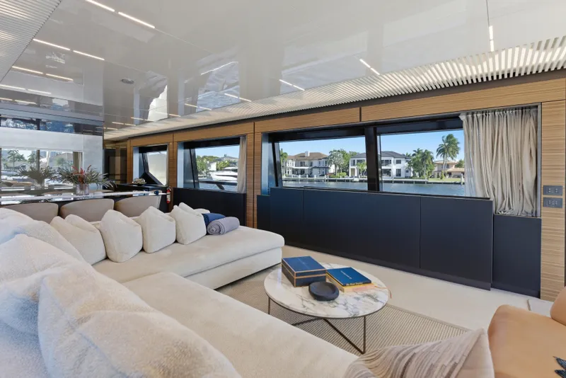 Slide: The Image of Luxurious interior of 2018 Ferretti Yachts 920 with elegant dining and seating area overlooking the water. - 29