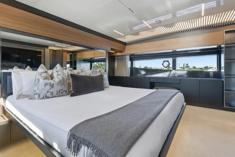Slide: The Image of Luxurious bedroom interior of 2018 Ferretti Yachts 920 with modern decor and large windows. - 41