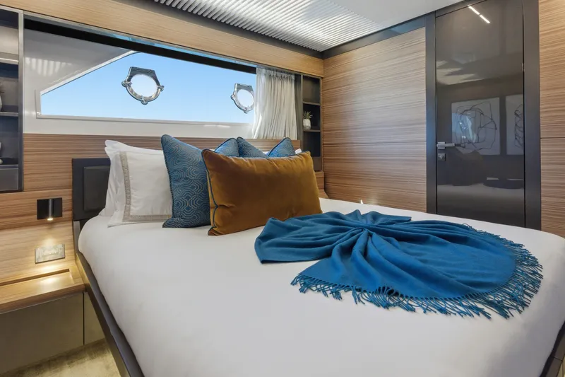 Slide: The Image of Luxurious Ferretti Yachts 920 bedroom interior, featuring modern decor and elegant bedding, 2018 model. - 60