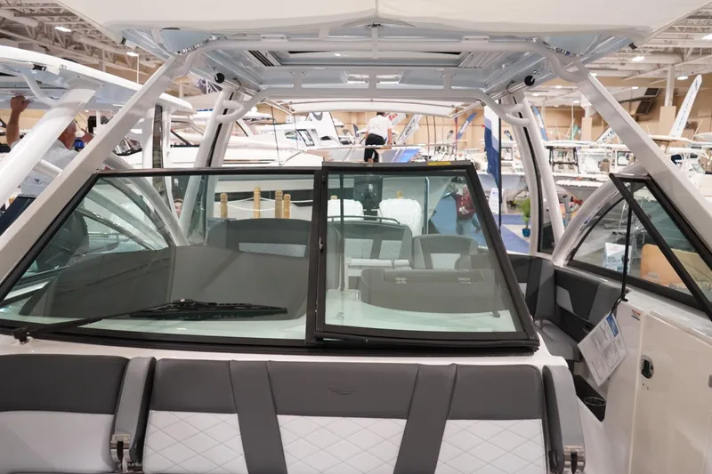 Slide: The Image of Luxurious interior of 2026 Chaparral 310 OSX boat with plush seating and modern design. - 11