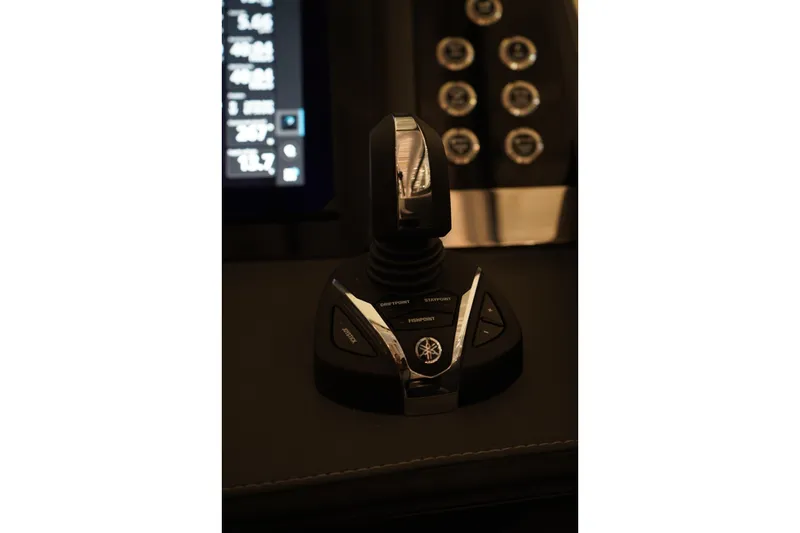 Slide: The Image of Manufacturer Provided Image: Top view of 2025 Chaparral 310 OSX boat layout, featuring seating and helm. - 12