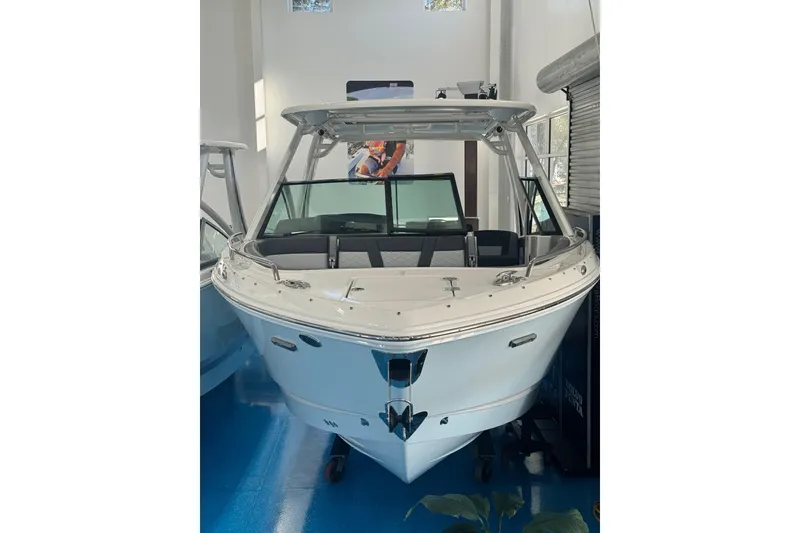 Slide: The Image of Control panel of 2026 Chaparral 310 OSX boat with audio and navigation features. - 15