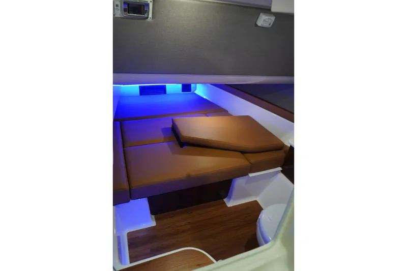 Slide: The Image of 2026 Chaparral 310 OSX boat seating with gray and white cushioned design. - 7