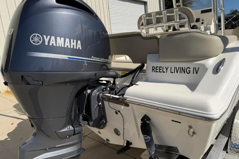 Slide: The Image of 2023 Key West 203 FS boat with Yamaha engine, named "Reely Living IV." - 12