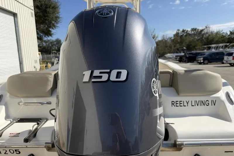 Slide: The Image of 2023 Key West 203 FS boat with Yamaha 150 engine, "Reely Living IV" name visible. - 14